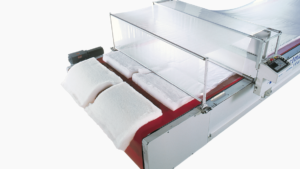 EasiHold securing lofted material on cutting surface